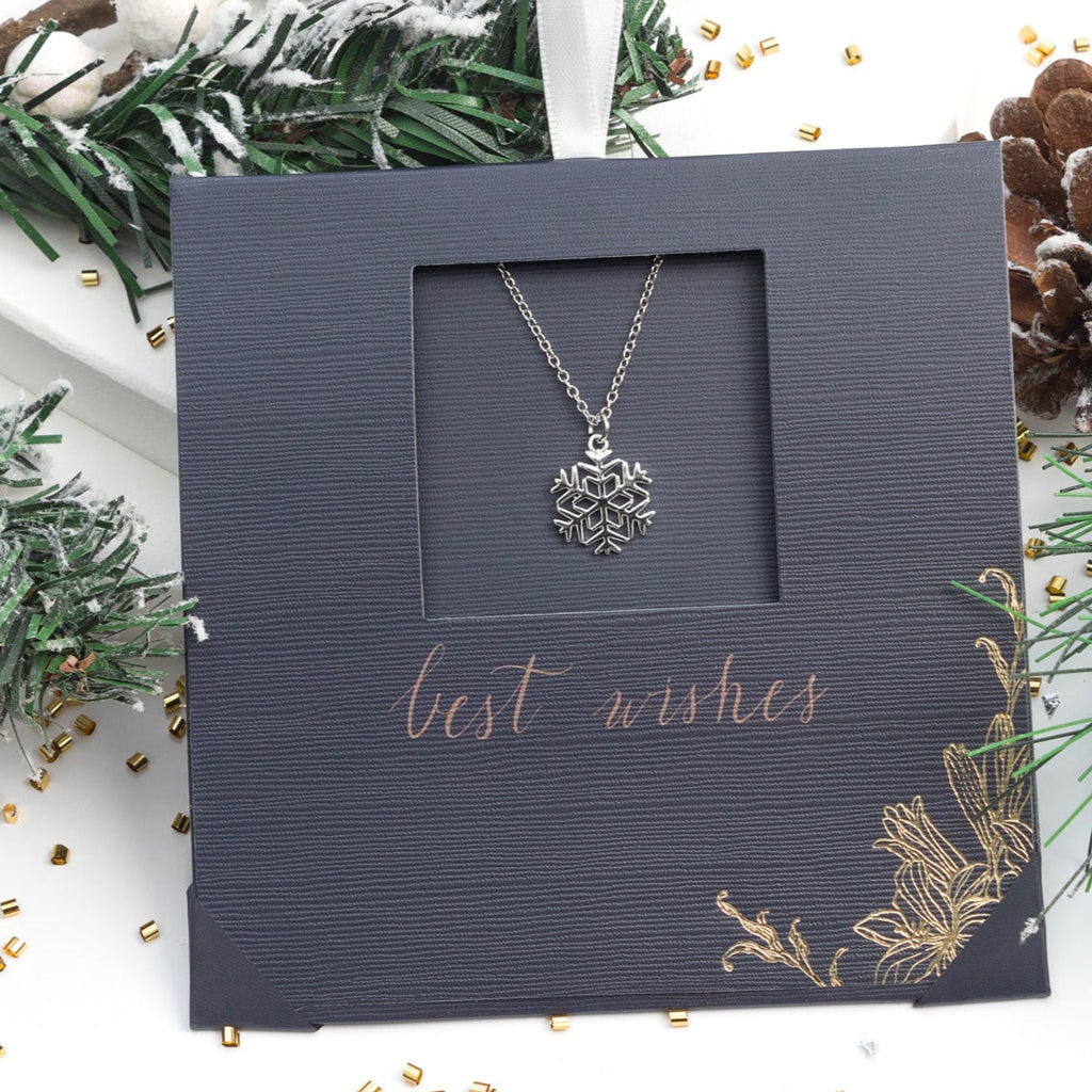 Rhodium plated stainless steel snowflake necklace, minimalist winter design, gift-ready by callura